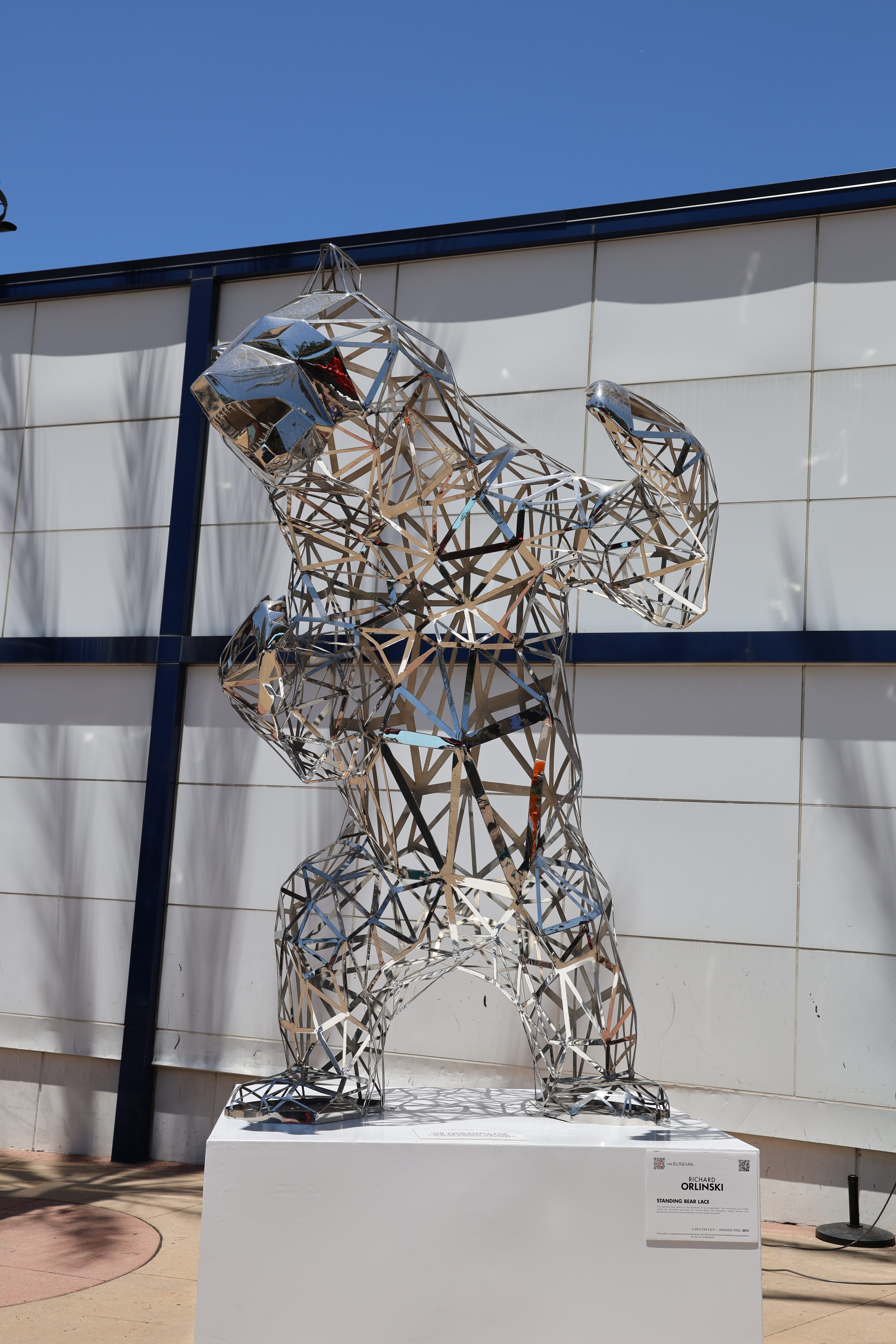 Chrome mirror bear sculpture reflecting the Burbank skyline